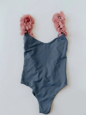 Original swimsuit flat lay on plain background